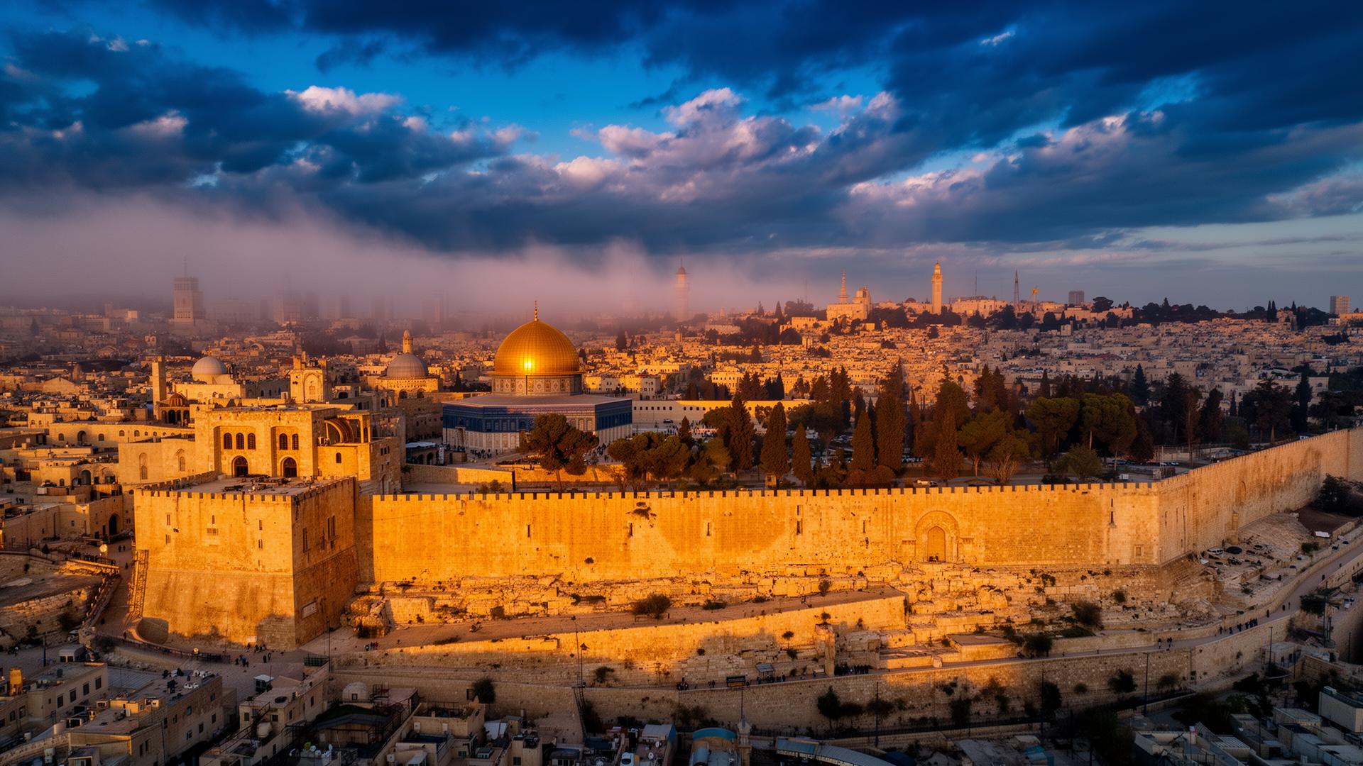 Aerial view of Jerusalem at golden hour with the Dome of the Rock